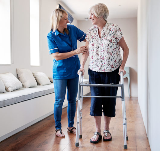 nurse helping senior patient