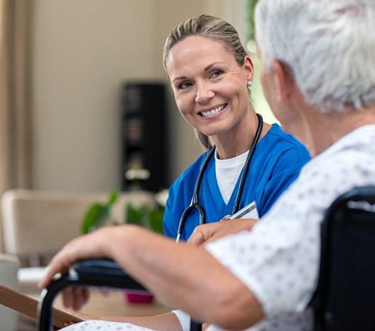 Nurse talking to senior patient.