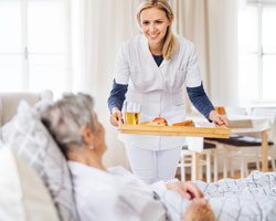 CNA feeding patient